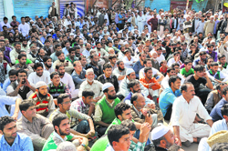 Residents during the two-hour sit-in protest in Shopian on Friday. 