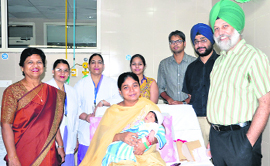 The kidney recipient with her baby at the DMCH. 