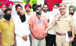 The accused in police custody.