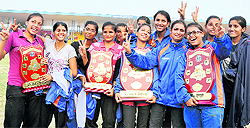 Winning teams pose for the shutterbugs with their trophies