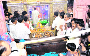 Devotees pay obeisance at the shrine of Mata Mansa Devi early in the morning on the occasion of the first Navratras in Haridwar on Saturday.