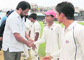Mayor Sunil Jyoti shakes hands with players during Bhai Gobind Singh Pasricha Memorial Cricket Tournament at MGN Public School in Jalandhar on Saturday