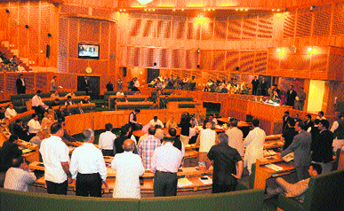 Panthers Party legislators raise slogans in the state Assembly in Srinagar on Saturday.