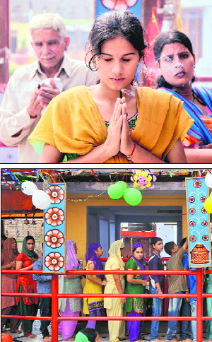 Devotees pay obeisance at Kali temple on the occasion of the first Navratra in Jammu on Saturday. 
