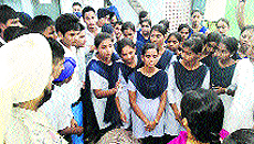 Students apprise Naib Tehsildar of their grievances in Khamano on Saturday