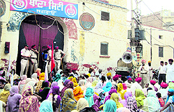 Villagers stage a dharna at the Jagraon police station on Saturday