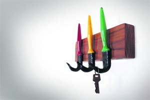 Wall hooks made of discarded paintbrushes combine utility with style