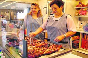 A woman serving the famed Olma sausages of St Gallen