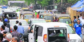 Auto-rickshaws cause a traffic snarl on a road in Amritsar.
