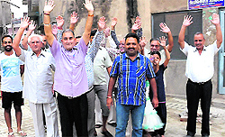 Residents of Neeta Street, near Mehna Chowk, protest against the Municipal Corporation (MCB) for laying interlocking tiles without levelling the road, in Bathinda on Sunday