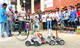 Students take part in a “robo war” during the annual fest on Sunday