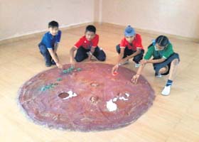Students make a model using clay and other material during World Space Week function at Zee School in Dera Bassi