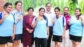 Members of the TT team of GGDSD College, Sector 32, flash the victory sign after winning the Panjab University Table Tennis Championship in Chandigarh on Sunday