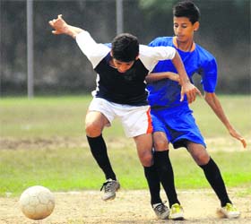 Players in action during a match of the CBSE Cluster XIII Football Championship in Chandigarh on Sunday