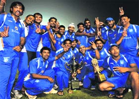 Team members of Reliance-I in a jubilant mood after winning the JP Atray Memorial Cricket Cup at the Cricket Stadium, Sector 16, in Chandigarh on Sunday