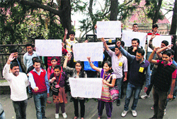 Activists of the ABVP raise slogans at the DC's office in Shimla on Sunday. 
