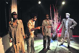 Artistes enact a scene from the play Hawalat staged at Natrang studio theatre in Jammu on Sunday