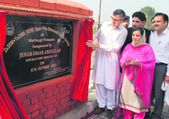 Chief Minister Omar Abdullah along with Social Welfare Minister Sakina Itoo inaugurates a bridge over the Romshi stream in Pulwama district on Sunday.