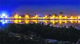 Visual delight: The water of Brari Numbai lagoon in Srinagar turns luminous on Sunday evening