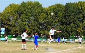 Players in action during the football tournament in Kupwara on Sunday