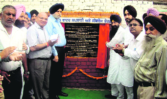 Public Works Department Minister Sharanjit Singh Dhillon lays the foundation stone of a sewerage plant in Dhandhari on Sunday.