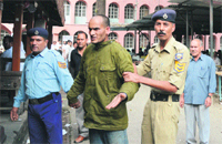 A prisoner in police custody in Mandi on Friday.