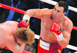 Ukrainian heavyweight boxing world champion Vladimir Klitschko (R) fights with Russian heavyweight boxer Alexander Povetkin in Moscow. 