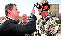 German Foreign Minister Guido Westerwelle with a German soldier at an army base in Afghanistan on Sunday