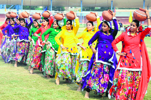 Students of RBDAV School present a cultural item during the inauguration ceremony of the 59th Punjab State School Sports at the Multi-purpose Sports Stadium in Bathinda on Monday.