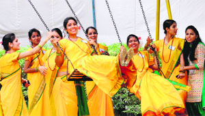 Students of the Guru Gobind Singh College for Women, Sector 26, enjoy swings during the youth festival on the college campus on Monday.