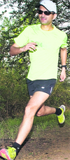 Alumni of Wynberg Allen School Rajat Chauhan runs a marathon race in Mussoorie on Monday. A Tribune photograph