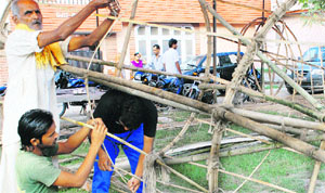 Artists busy preparing Ravanas effigy in Ambala City. 