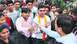 Aditya Sharma, president, Student Council, argues with Principal RP Chopra during a protest on the college campus in Dharamsala on Monday. Photo: Kamaljeet