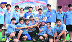 Players of Police DAV School in a jubilant mood after winning the Ivy and KOOH Football Tournament in Jalandhar on Monday. A Tribune photograph