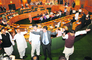 BJP and National Panthers Party members protest in Assembly on Monday. 