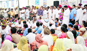 Congress leaders and workers protest against the imposition of property tax outside the MC Zone A office near Mata Rani Chowk in Ludhiana on Monday. 