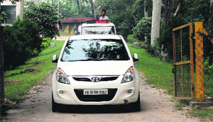 Wildlife officials leave the tiger safari following the death of two tigresses near Amaltas. 