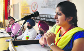 A student takes part in a debate at the fourth inter-college youth festival at Guru Angad Dev Veterinary and Animal Sciences University in Ludhiana. 