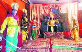 Artistes enact a scene at a Ramlila in Amritsar
