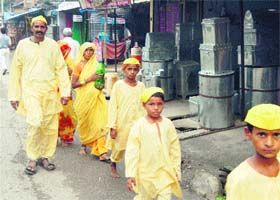 Yellow-clad pilgrims in Kangra town on Tuesday