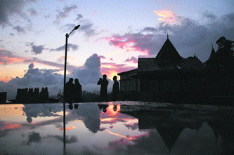 People enjoy the sunset after a downpour in Shimla on Tuesday.