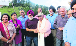 A group of Punjabi artists honour Vijay Sharma of Chamba at Khajjiar.