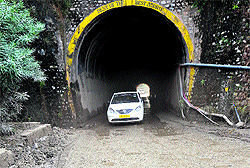A motorist drives through the dilapidated Nandni tunnel on the Jammu-Srinagar national highway