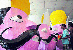 Ahead of Dasehra, final touches being given to an effigy of Ravana in Jammu on Tuesday