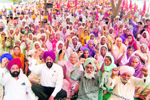 Farmers protest in Ajnala on Tuesday.