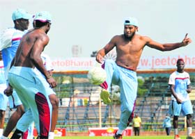 Windies A team warms up playing football on the eve of the match, on Tuesday