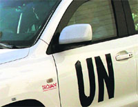 A UN vehicle carries team of arms inspectors.  AFP