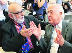 Peter Higgs (R) and Francois Englert before a news conference on the search for the Higgs boson at the CERN in Meyrin near Geneva in this file photo. 