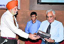 Vice-Chancellor Lt-Gen (retd) DDS Sandhu (left) presents a memento to Lt-Gen (retd) SS Mehta, a former Army Commander, at the Senate Hall of Kurukshetra University on Wednesday