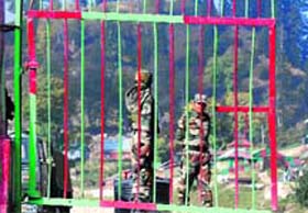 Soldiers stand guard at Furkian Gali, the entry point to the Keran sector of north Kashmir